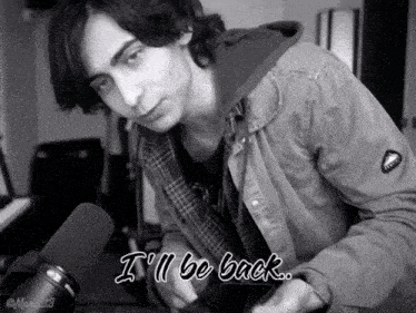 a black and white photo of a young man with the words i 'll be back