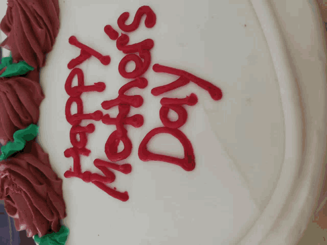 a cake that says happy mother 's day in red frosting