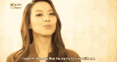 a woman is saying that she wants him to sing with her