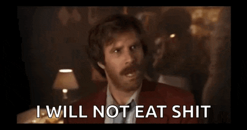 a man in a red suit and tie says i will not eat shit