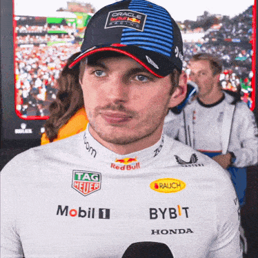 a man wearing a hat with the word red bull on it