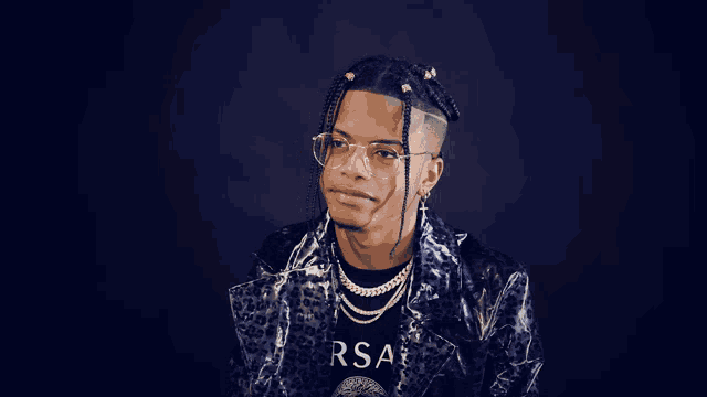 a man wearing glasses and a leopard print jacket has the word period on his shirt