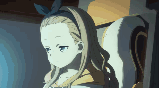 a girl with blonde hair and blue eyes is wearing a headband with a bow