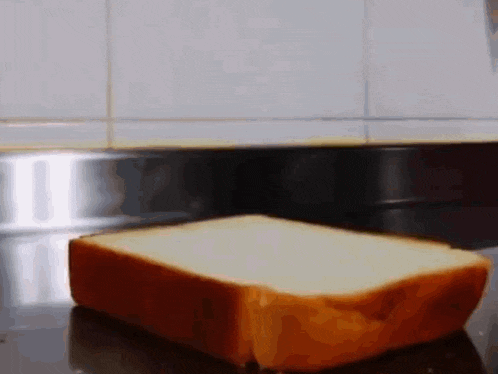 a slice of bread is sitting on a counter