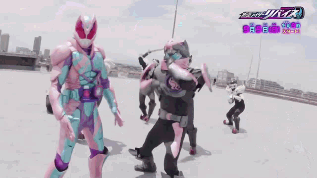 a group of people are standing in front of a sign that says " kamen rider "