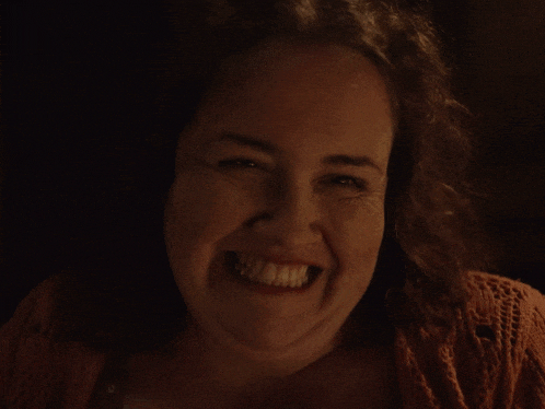 a woman with a big smile on her face