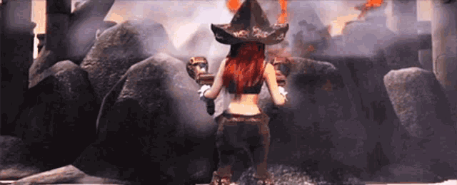 a woman with red hair wearing a pirate hat stands in front of a rock wall