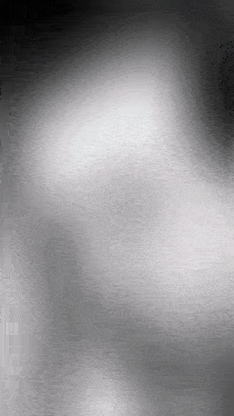 a black and white blurred background with a gray gradient