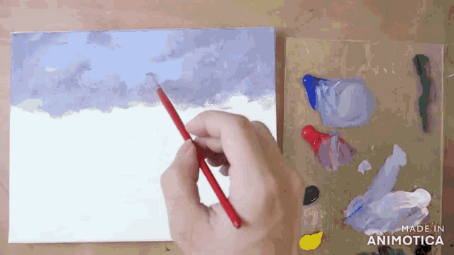 a hand is holding a brush in front of a palette that says made in animonica