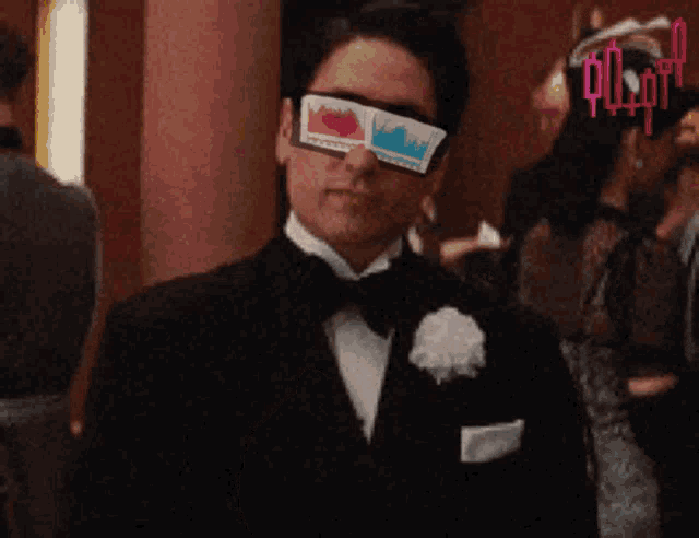 a man in a tuxedo wearing a pair of 3d glasses with the word pulp on the bottom