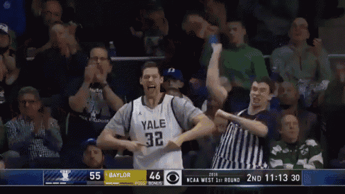 a basketball player wearing a yale jersey celebrates with fans