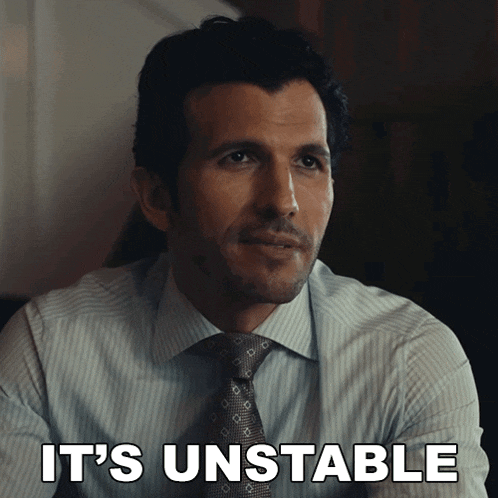 a man in a suit and tie has the words it 's unstable written on his face
