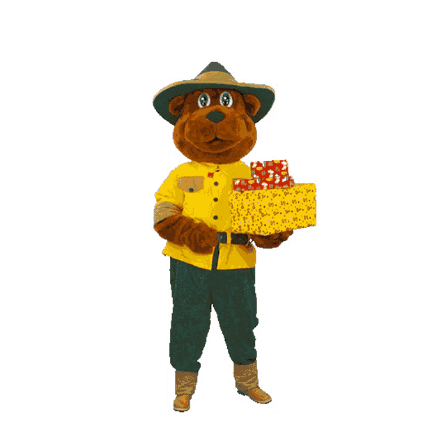 a stuffed animal wearing a hat and holding a gift