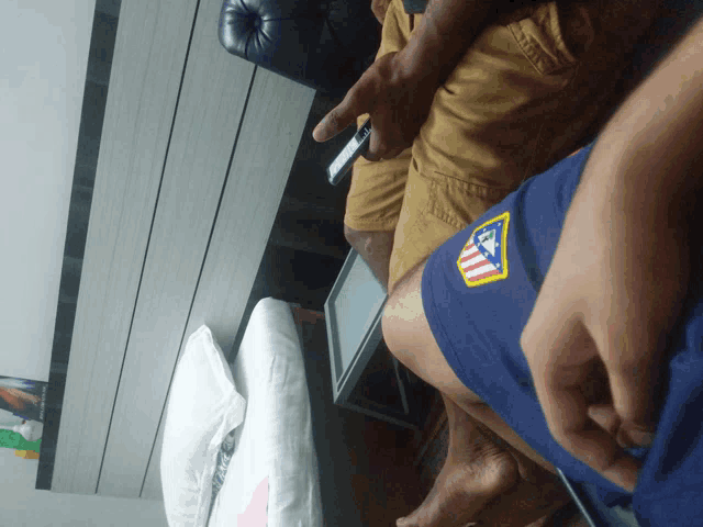 a person wearing a pair of shorts that say atlético madrid