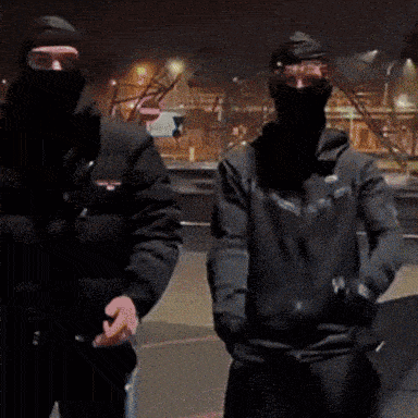 two masked men are standing next to each other and the word lapy is visible