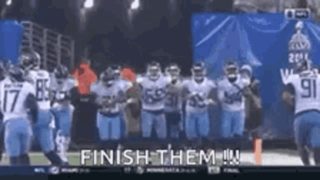 a group of football players standing on a field with the words finish them written on the bottom