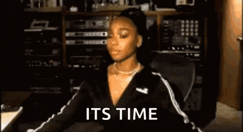 a person is playing a keyboard with the words `` it 's time '' written on the keyboard .