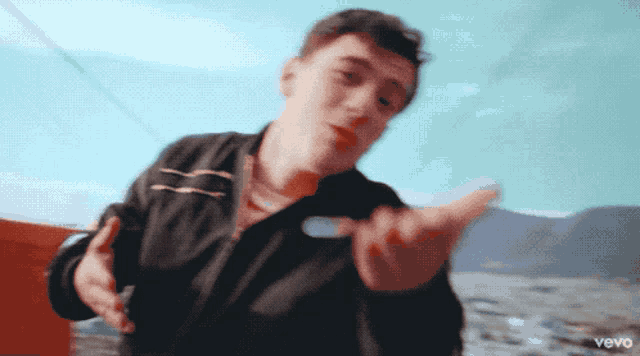 a blurry picture of a man with the word vevo on the bottom left