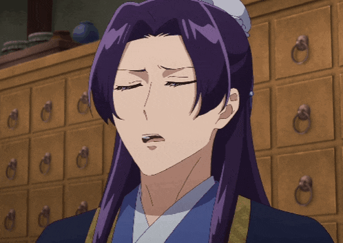 a woman with purple hair is standing in front of a cabinet