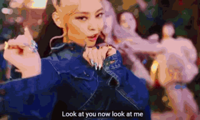 a blurry picture of a woman with the words look at you now look at me on the bottom