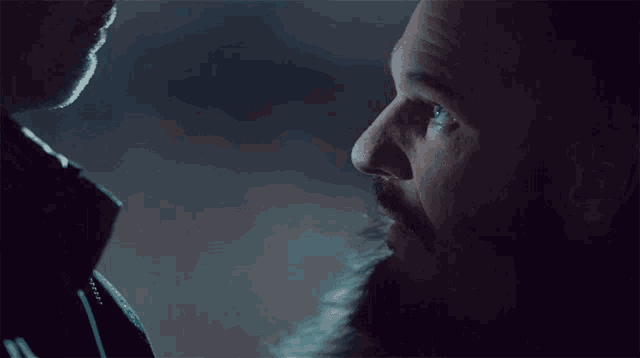 a man with a beard looks at another man with the words " step aside old man " above him