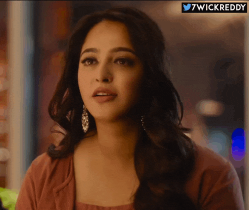 a close up of a woman 's face with the hashtag 7wickreddy below her