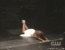 a woman is flying through the air with her arms outstretched in a gif from senorgif.com