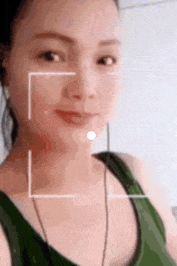 a close up of a woman 's face with a white square around it