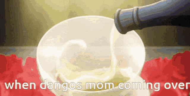 a bottle of wine is pouring into a glass with the words when dangos mom coming over