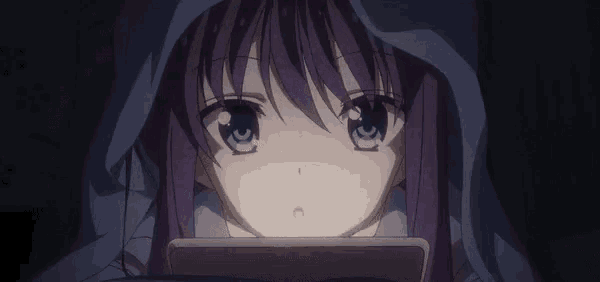 a girl with purple hair is looking at a cell phone