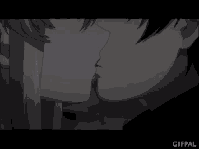 a black and white photo of a man and a woman kissing with the gifpal logo in the corner