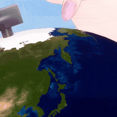 a close up of a person holding a globe