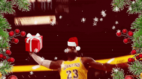 a basketball player wearing a santa hat is holding up a gift