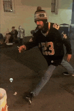 a man wearing a jersey with the number 23 on the front