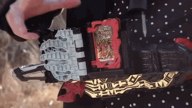 a person is holding a toy that says brave dragon on it