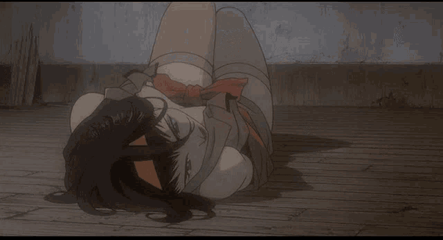 a woman is laying on the floor with her head down