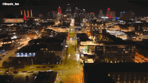 an aerial view of a city at night with the words royals jun on the bottom