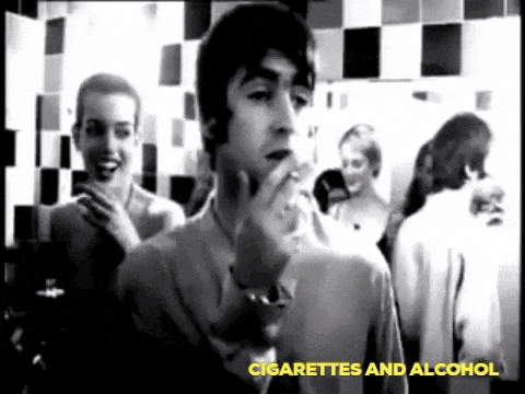 a man is smoking a cigarette in a black and white photo with the words cigarettes and alcohol below him