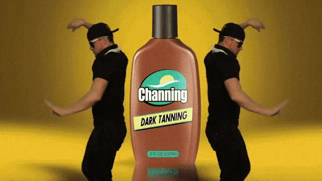 two men are dancing in front of a bottle of channing