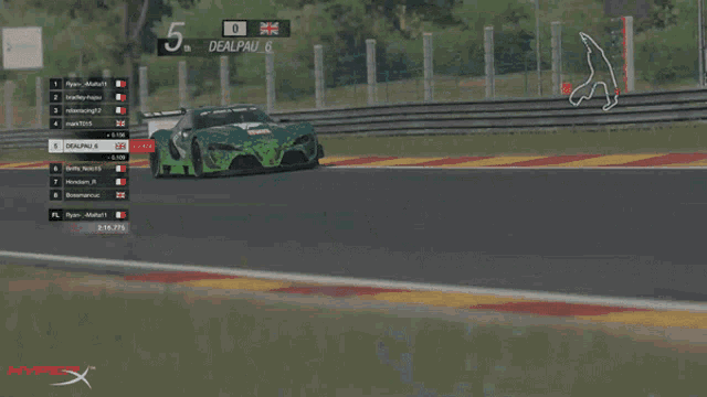 a race car is driving down a track with the number 5 on the screen