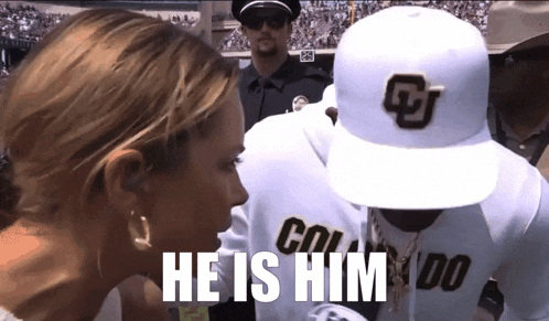 a man wearing a hat that says colorado is talking to a woman