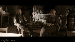 a man and woman are sitting in front of a fireplace with the words fuck off written above them