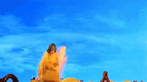 a cartoon character is standing in front of a blue sky with flames coming out of it .