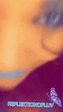 a close up of a person 's face with a butterfly and the words reflexionofluv below it