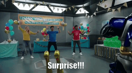 a group of people dancing in front of a sign that says thank you beast bots