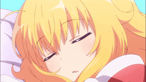 a girl with blonde hair and blue eyes laying down