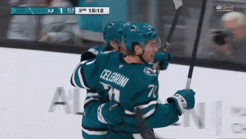 a hockey player named celebroni is hugging another player on the ice