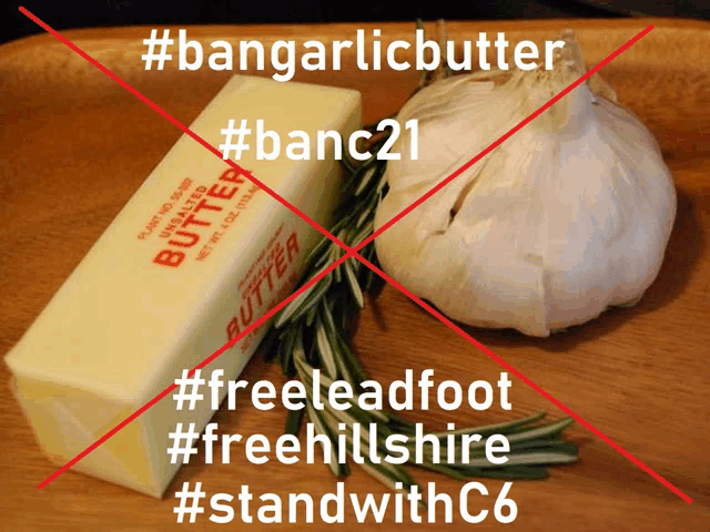 a block of butter next to a garlic bulb with the words #bangarlicbutter and #banc21 crossed out