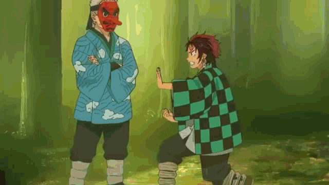 a man in a red mask is standing next to a man in a blue jacket .