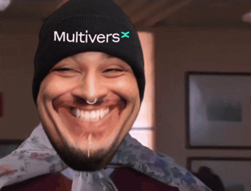 a man wearing a beanie that says multivers x on it
